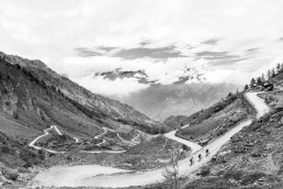 Limited edition fine art cycling print of 3 cyclists riding the gravel hairpins of Colle delle Finestre. The cl famous climb often feature in the Giro d'italia Shot for Cyclist Magazine by Patrik Lundin - cycling prints, fine art cycling print, limited edition prints, limited edition cycling prints, cycling photos, cycling images, cyclist, hairpin, hairpin road, cycling, cyclist magazine, gift, gift for cyclists