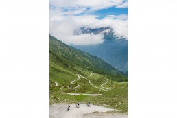 Limited edition fine art cycling print of 3 cyclists riding the gravel hairpins of Colle delle Finestre. The cl famous climb often feature in the Giro d'italia Shot for Cyclist Magazine by Patrik Lundin - cycling prints, fine art cycling print, limited edition prints, limited edition cycling prints, cycling photos, cycling images, cyclist, hairpin, hairpin road, cycling, cyclist magazine, gift, gift for cyclists