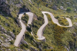 Limited edition fine art cycling print of three cyclists climbing Sa Calobra in Majorca. Shot for Cyclist Magazine by Patrik Lundin - cycling prints, fine art cycling print, limited edition prints, limited edition cycling prints, cycling photos, cycling images, cyclist, hairpin, hairpin road, cycling, cyclist magazine, gift, gift for cyclists