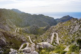 Limited edition fine art cycling print of three cyclists climbing Sa Calobra in Majorca. Shot for Cyclist Magazine by Patrik Lundin - cycling prints, fine art cycling print, limited edition prints, limited edition cycling prints, cycling photos, cycling images, cyclist, hairpin, hairpin road, cycling, cyclist magazine, gift, gift for cyclists