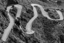 Limited edition fine art cycling print of three cyclists climbing Sa Calobra in Majorca. Shot for Cyclist Magazine by Patrik Lundin - cycling prints, fine art cycling print, limited edition prints, limited edition cycling prints, cycling photos, cycling images, cyclist, hairpin, hairpin road, cycling, cyclist magazine, gift, gift for cyclists