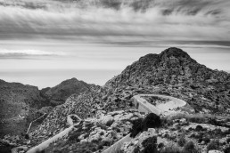 Limited edition fine art cycling print of three cyclists on top of Sa Calobra in Majorca. Shot for Cyclist Magazine by Patrik Lundin - cycling prints, fine art cycling print, limited edition prints, limited edition cycling prints, cycling photos, cycling images, cyclist, hairpin, hairpin road, cycling, cyclist magazine, gift, gift for cyclists